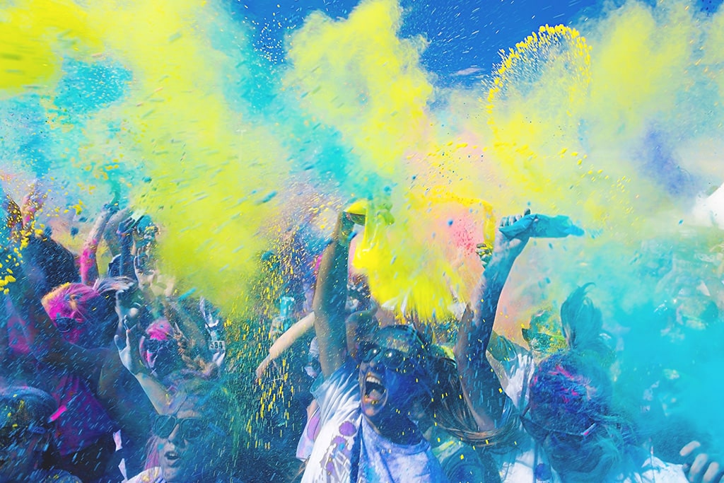 People spraying colour in the air