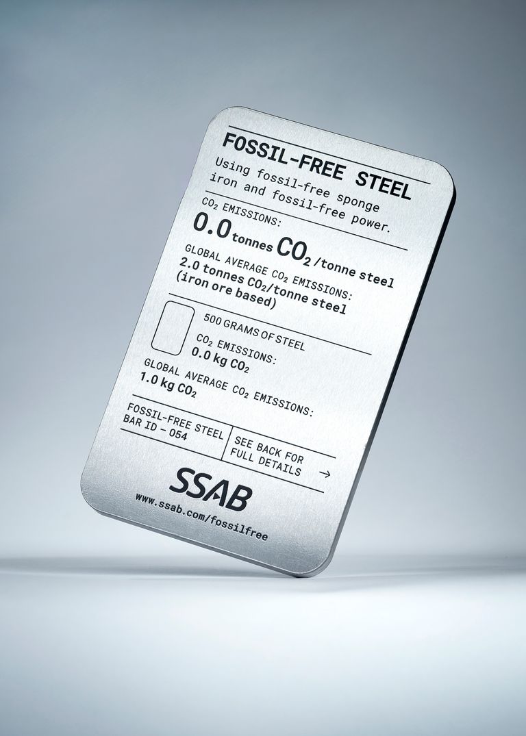 A metal card detailing information about fossil-free steel with environmental statistics and a qr code.